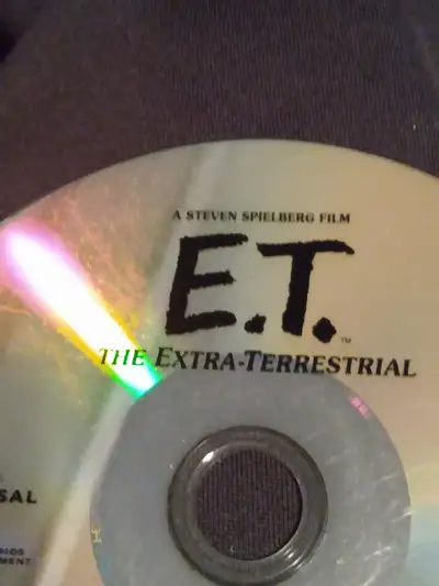 A troubled child summons the courage to help a friendly alien escape from Earth and return to his ho...