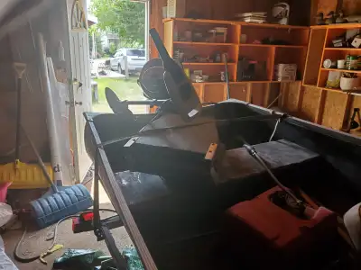 14 ft boat with trailer 18 hp motor troling motor padles anger bail buckets i have strap on motor be...