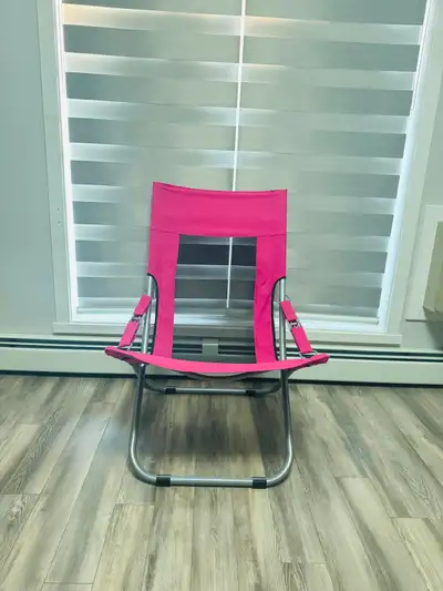 Get ready for summer relaxation with this vibrant pink folding chair! Perfect for the beach, camping...