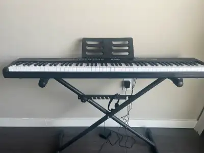88 key keyboard (almost new) with stand, View more