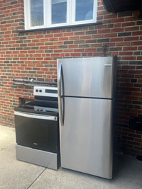 ALMOST new stainless steel fridge and glass top stove 