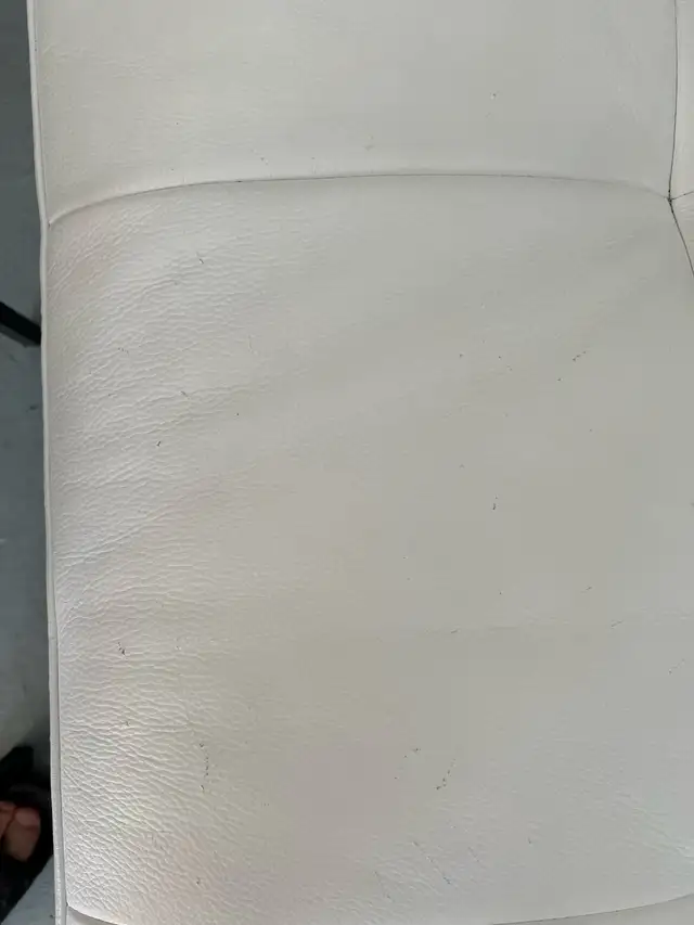 white couch with cat stratches on it63009267823873121