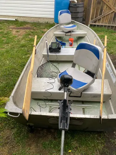 Boat, 32 lb thrust electric trolling motor, new marine battery, two boat seats, oars,anchor & line,...