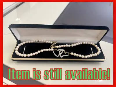 Two Golden Hearts with Diamonds Pendant on a Pearl Necklace!, View more
