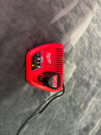  Milwaukee  m12 Charger and three amp battery