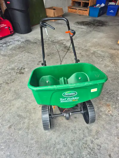Broadcast spreader. Like new. Large capacity. Edge guard feature. For fertilizer, salt, seed.