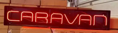 Brighten up your garage or man cave with this vibrant Dodge Caravan neon sign, which is in good work...