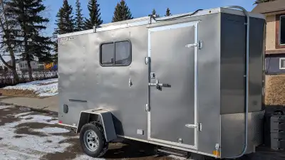 6’ x 12’ V nose Wells Cargo converted utility camper/toy hauler. Professionally converted, insulated...