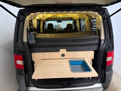 Brand new - camper conversion kit with a table and small sink. Fits any minivan or SUV. Does not req...