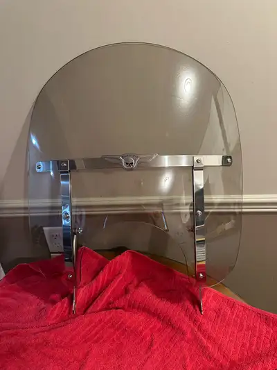 Upgrade your ride with this Harley-Davidson windshield designed for a Fat Boy model. In great shape....