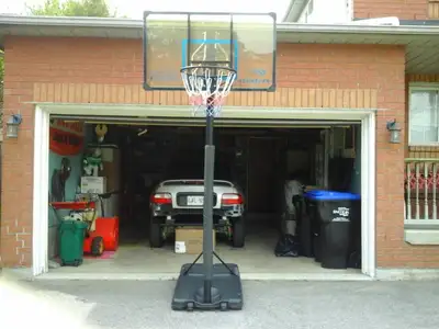 48" Matrix basketball net. Adjustable height, padded post. Fill the base with sand or water as per i...