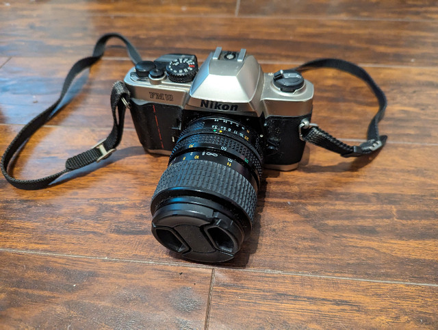 Nikon FM10 film camera made in Japan with Len for sale in Cameras & Camcorders in City of Toronto