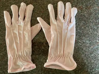 New, never used, light pink women’s gloves for sale. One size at wrist length. Price $2.00 Front por...