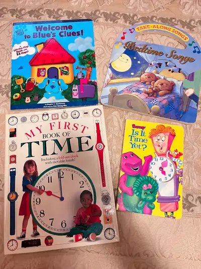 Lot of four large board books, like new conditions, including Barney Is it time yet? With a toy cloc...