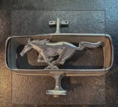 This original vintage Ford Mustang grille emblem is in good pre-owned condition, featuring the class...