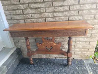 Modified table as a hall table 42 in Long stands 28 1/2 " high, 12 " deep hangs with two brackets Oa...
