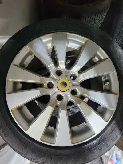 4 rtx 17" rims for sale with snow tires that are mounted...one tire has a broken belt
