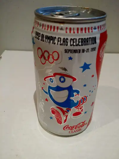 Coca-Cola collectors I have 1 Coca-Cola Classic 1992 Olympic Flag Celebration can (355ml from 1992)...