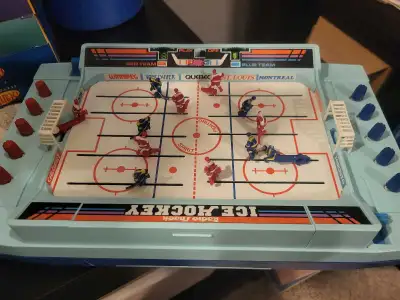 Experience classic gaming nostalgia with this vintage Radio Shack tabletop ice hockey game. This ite...