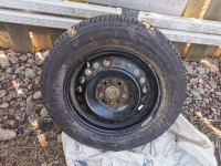 Set of wheels and tires off of a ford focus