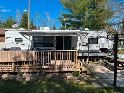 32’ Travel Trailer with 2 tip-outs • Open concept living room/ kitchen with sliding door … • Queen-s...