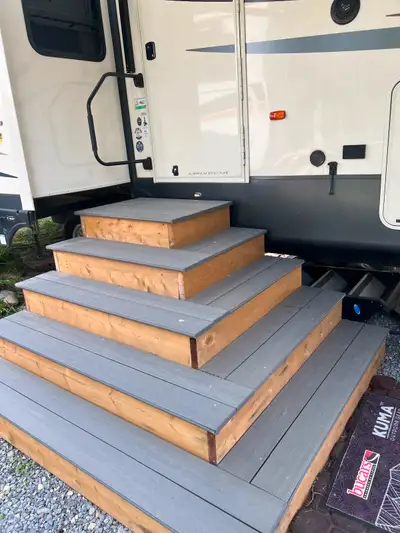 Steps pre made with all weather vinyl planking for fifth wheel or trailer Comes with iron work handr...