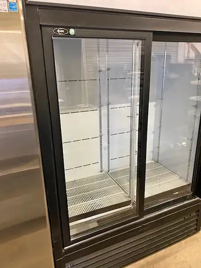 You are viewing an almost new QBD Upright cooler/fridge with a black cabinet and 2 glass sliding doo...
