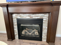 Gas fire place with oakwood mantel
