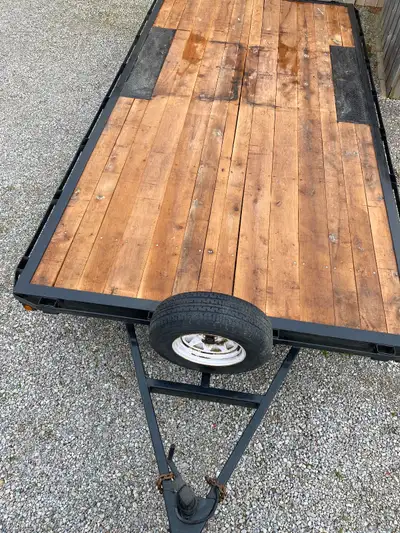 8ft x 16ft deck over trailer with rails all the way around . Newer oak decking and brakes. Front axl...