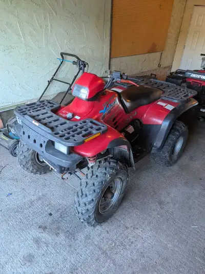Quad starts easy. Runs and drives. It's a 400cc 2 Stroke. Plastics are mint and tires are new. Low k...