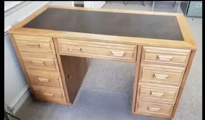 Unique style bankers desk features a solid wood frame and leather inlay, perfect for a home office o...