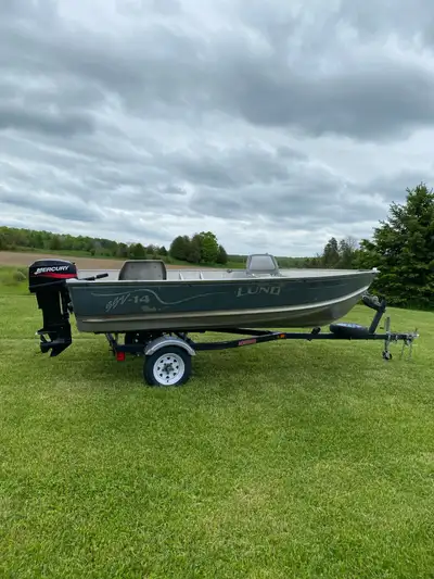 2001 Lund SSV-14 boat is deep and wide. 2001 Mercury 20hp 2 stroke short shaft with electric start,...