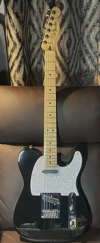 A new MIM Tele with black Alder body, Maple "C" 9.5" radius, 22 fret neck, Upgrades include pearloid...