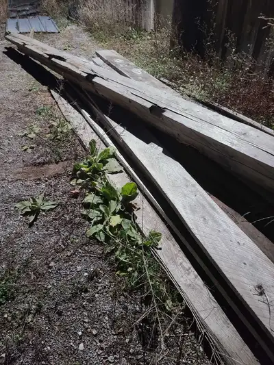 Approximately 8"x8"×15', hand hewn timber squared 3 sides, from an old barn. $150 or make me an offe...