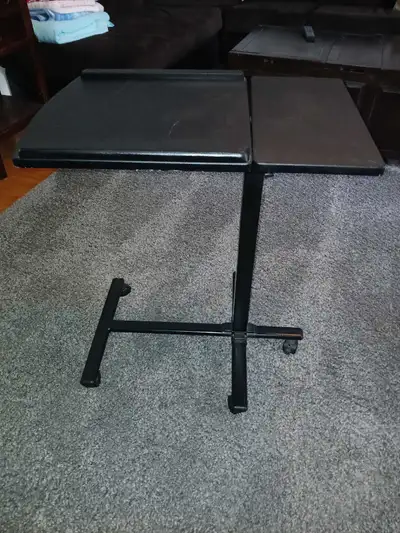 For sale today is an Adjustable Laptop Table. Tilts and raises/lowers. In great shape. Perfect for w...