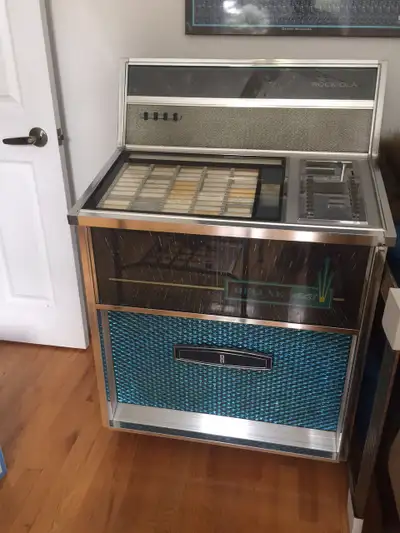 Gorgeous 1967 Rock Ola juke box that plays 45’s Turns on and lights up nicely No rust Shows mint wit...