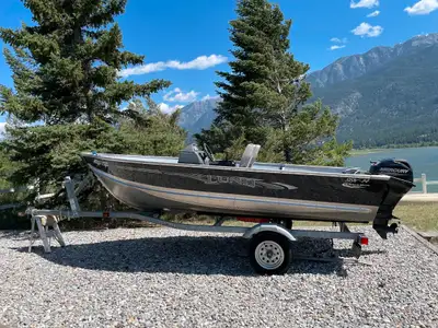 2020 Lund SSV-14 with steering wheel and extra seat, Mercury four stroke 20 hp engine, and trailer....