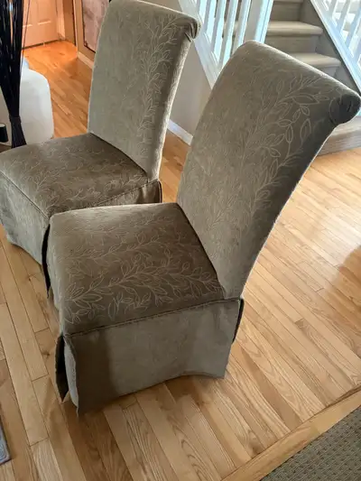 Two dining room accent chairs in excellent condition. Curved top elegance with panelled base coverin...