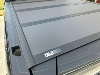 Rev trifold tonneau cover from a 2024 Silverado HD standard box. Securely stores any items in the bo...