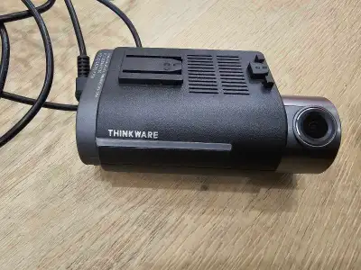 Capture the road ahead and behind with this pre-owned Thinkware F750 dash cam, featuring a front-fac...