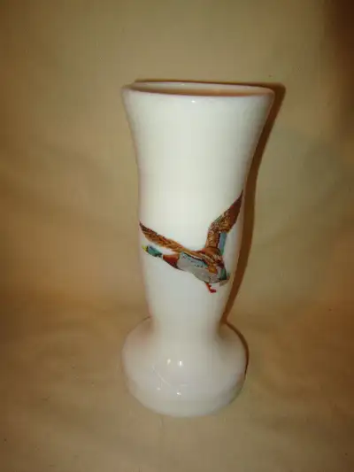 This vase is in good used condition with no damage. Not sure if someone put the ducks on, or it came...