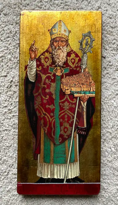This is an icon of Saint Blaise handpainted on an oak wood plaque with gold leaf detail. It is 13” h...