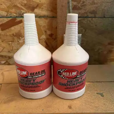 I'm selling one new and one used bottles of Red Line Heavy Shockproof Gear Oil, perfect for high-per...