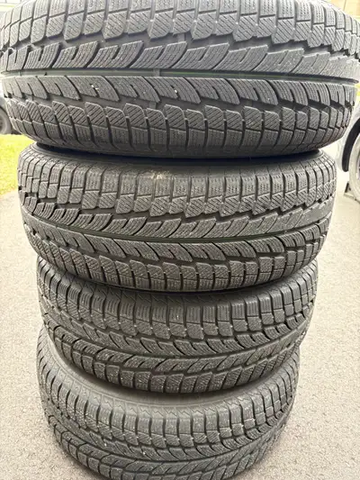 I am selling a set of used Powertrac winter tires, size 225/65R16, mounted on steel rims. These tire...