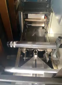 Horizontal wrap machine for convenient grab and go food products
