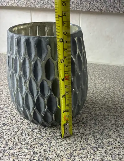 Grey and silver textured glass vase. - honeycomb-like pattern on the outside - Measures 5.5” wide an...