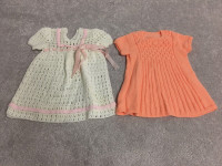 Homemade children’s dresses, sweaters and shawl
