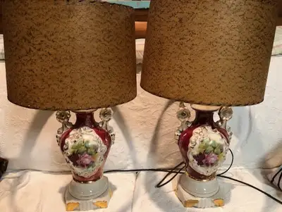 Two Victorian floral table lamps. Original shades. Red glass finial. In very good condition.