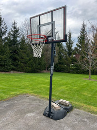 Outdoor adjustable basketball net