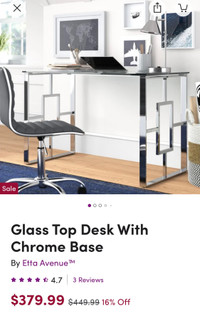 Glass top desk with chrome base and heavy duty office chair